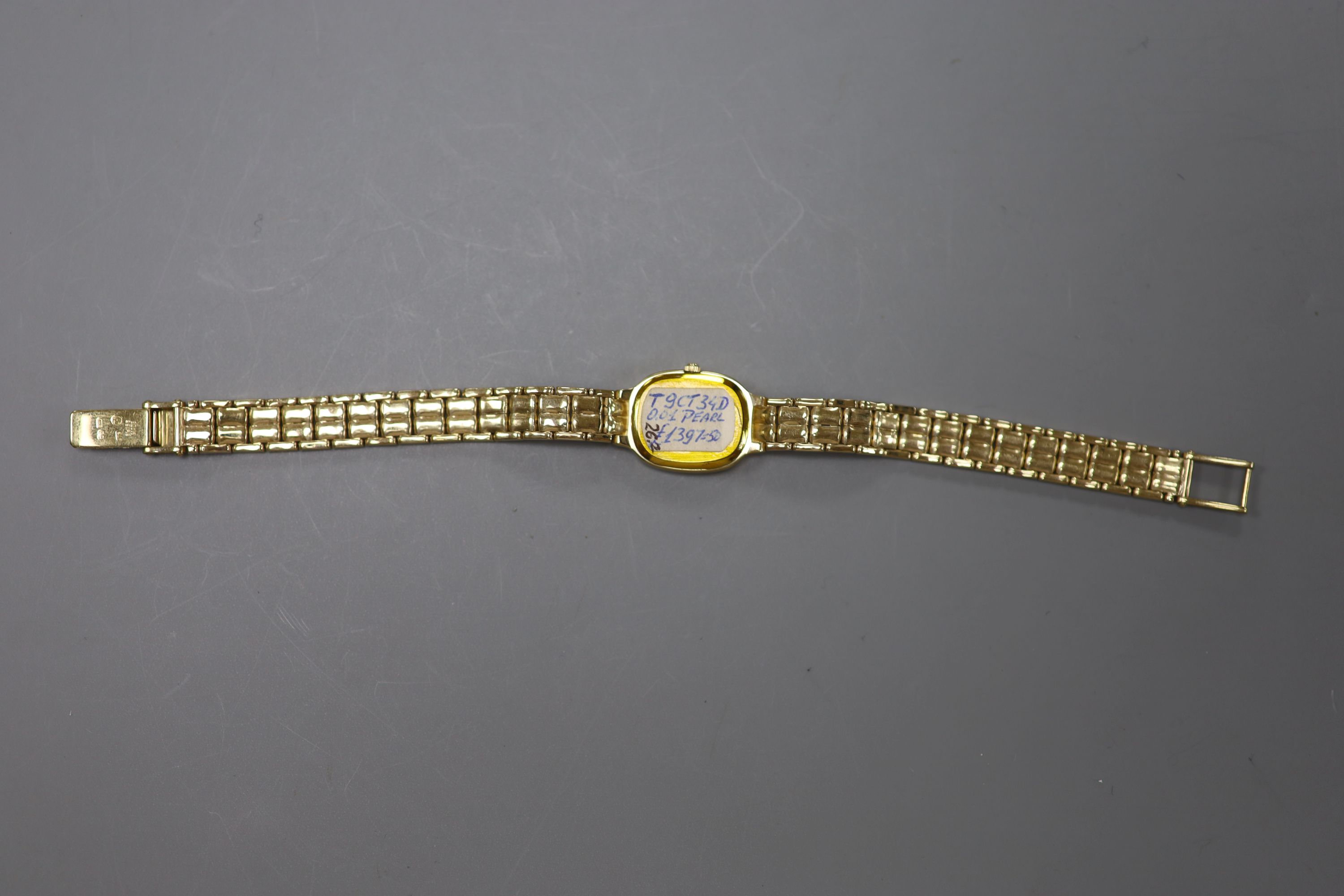 A lady's modern 9ct gold and diamond set Tissot Saphir quartz? wrist watch, 18.5cm